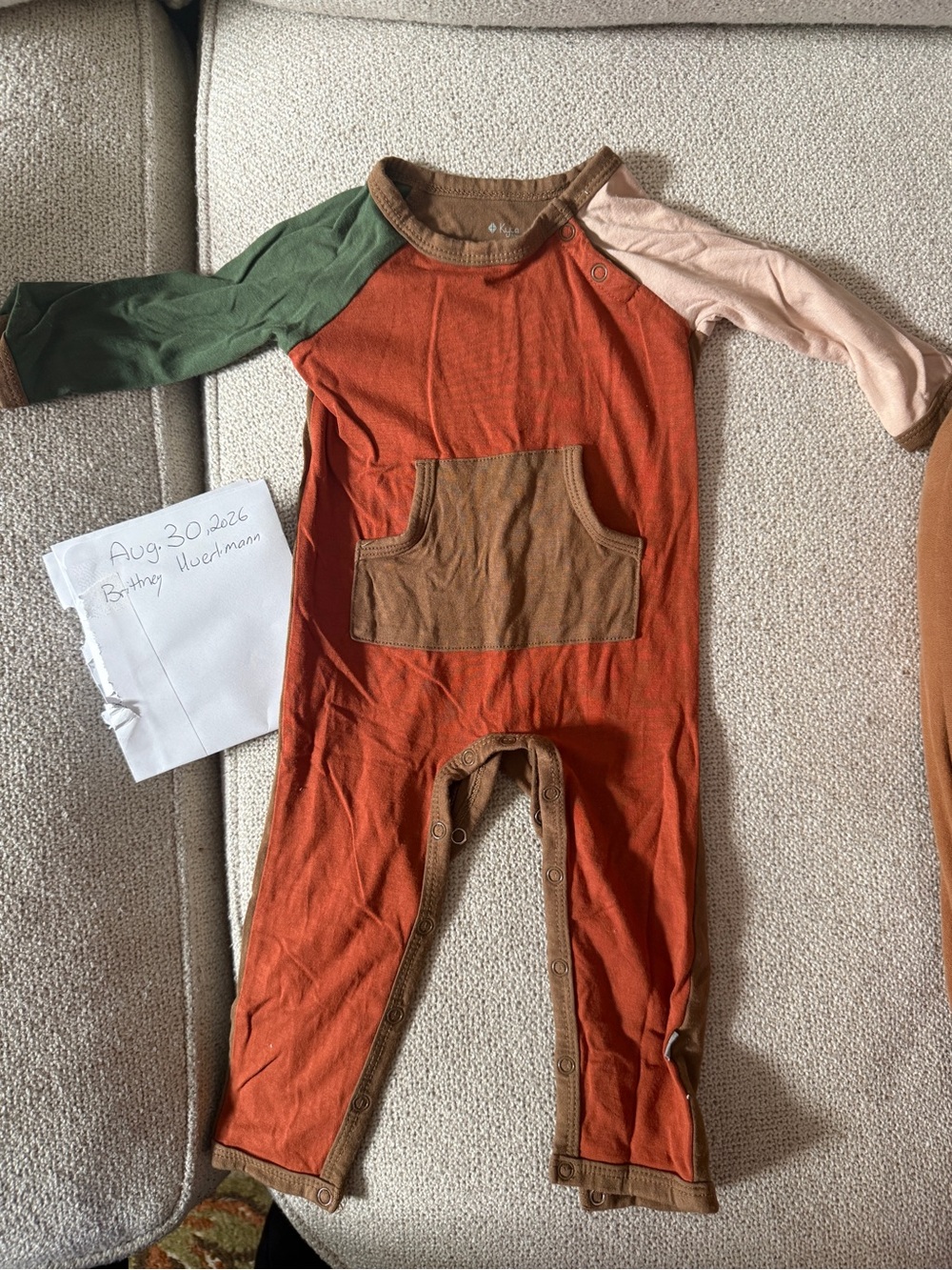 Kyte BABY Orange Raglan Footie with Green & Cream Sleeves
